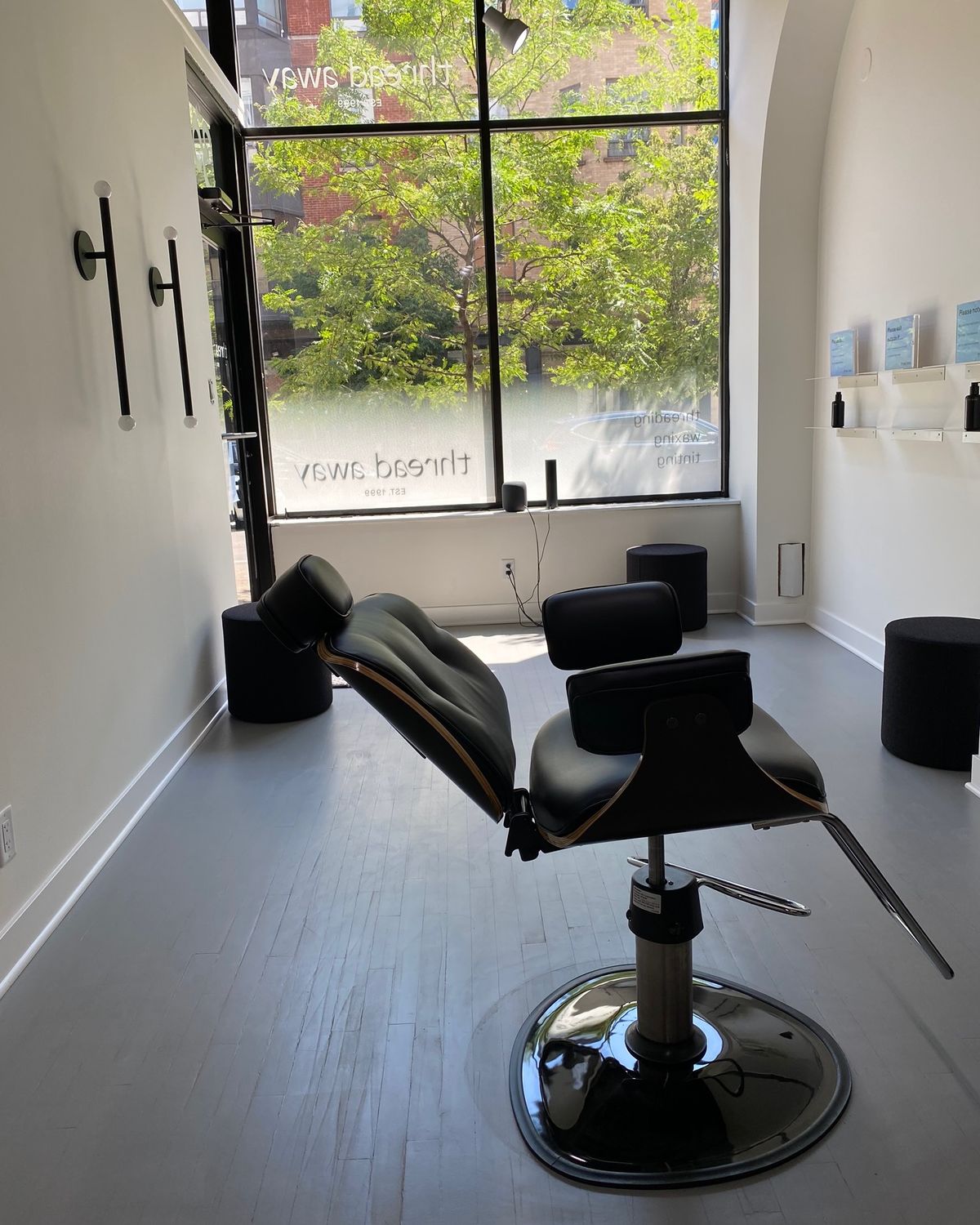 A threading chair at thread away, morning light through the front window